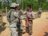 U.S. Army 8th Military Police Company 1Lt Megan Lewis and SFC Jed Wornock speak with a local national during checkpoint operations training at Exercise Shanti Doot-2