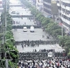 Chinese riot police face demonstrators in Urumqi, July 5th.