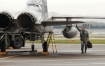 Lt. Tyler Cox of the 123rd Fighter Squadron, 142nd Fighter Wing conducts a post-flight inspection of his F-15