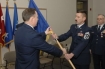 Oregon Air Guard's Mark D. Russell, (right), receives  command flag from Bruce W. Prunk