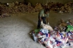 Humanitarian workers from the Dominican Republic prepare to distribute food in the slum of Cité Soleil