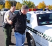 Kelly Ray Rasmussen of Medford as he is taken into custody by members of the Clackamas County Sheriff's Office.