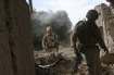 U.S. Marines position themselves before attacking a Taliban stronghold in Now Zad, Afghanistan