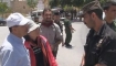 Professor Qumsiyeh confronts a Palestinian security forces officer about treatment of Palestinian youths in custody.