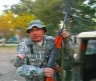 U.S. Army Sergeant First Class Kevin Shaughnessy handles our convoy's main weapon; a Soviet RPK automatic rifle.  Photos by Tim King  