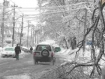 Snow with cars passing