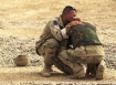 Photo from the Iraq war, a U.S. military police officer is comforted