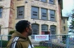 Bernard Powell of Salem, Oregon gazes at one of the state hospital's oldest buildings