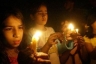 Palestinians girls light candles as a protest against the Israeli blockade of the Gaza Strip in ‎Gaza City on June 26, 2010.