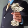 Man with money in suit