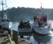 The Coast Guard motor lifeboat Intrepid takes the recreational vessel Sea Weed into side tow after the boat burned in Charleston Harbor, Oregon, on April 3rd, 2008.