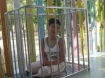 This orphan in Da Nang suffers from the effects of Agent Orange, in a cage; and this is one of the more fortunate victims.