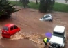 Flood carrying a car away in Australia