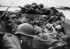 GIs keep low inside a landing craft during an assault across the Rhine at Oberwesel, Germany