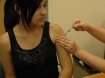 Girl receiving vaccine