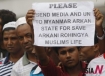 A Myanmar ethnic Rohingya Muslim holds a placard