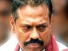 Rajapaksa scowling