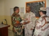 Iraqi Army Staff Major Mohammed presenting the Bronze Star Medal to Captain James Văn Thạch and Iraqi Army Major Ihsan is standing to the right.