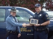 Captain Jeff Samuels, OSP Fish and Wildlife Division Director, presented Senior Trooper James Halsey the Division award during a Mid-Valley Team meeting at the OSP Albany Area Command office