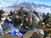 Aid being distributed to Afghan people in a remote mountain village in 2007