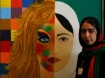 Khadija Hashemi, 21, an Afghan female artist, stands next to her painting during the first ever woman's art exhibition at Amani school in Kabul, Afghanistan in 2008. 