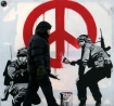 Soldiers paint peace sign by Banksy