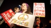 Protestors sign in Israel reads, reads, 'Bibi Don't Bomb Iran'