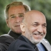 Former U.S. President G.W. Bush and Afghan President Hamid Karzai