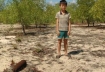 Duong Ba Tien with the unexploded bomb he found while tending his family's water buffalo in Quang Tri province, central Vietnam. Photograph: Simon Cordall