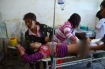 Medics at a hospital in Laiza, Kachin State, tend to Lamong Kailing, who was injured by the Burma Army shelling