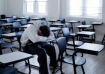 Teen alone in class