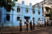 Authorities stand outside a madrasa in east Rangoon where 13 Muslim schoolchildren died after a fire in April. (Photo: The Irrawaddy / Steve Tickner)