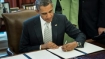 Obama signs the Monsanto protection act. Photo: rt.com