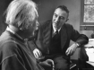 Physicist J. Robert Oppenheimer discusses theory of matter with famed Physicist Dr. Albert Einstein.