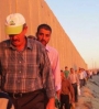 Palestinian men, above, show them standing in line next to the “Security” wall surrounding Jerusalem during Ramadan