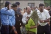 Rimsha being ferried from a court hearing.