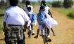 Sri Lankan children ride bicycles in Jaffna. (AFP)