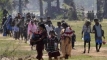 Sri Lankan Tamil civilians arrive at a government-controlled area after fleeing territory controlled by the LTTE in Puthukkudiyirippu, northeast Sri Lanka