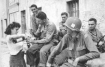 An American soldier offers advice to a French woman