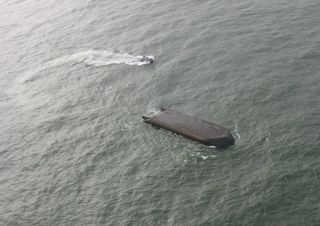 Capsized 295-foot barge near Astoria, Oregon.