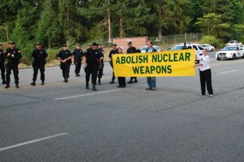 Photo of action attached (photo credit: Leonard Eiger, Ground Zero Center for Nonviolent Action).