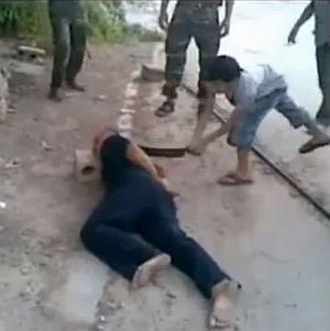 US-funded FSA child soldier beheads government victim.