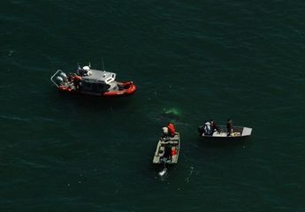 Coast Guard boats aid in search for downed helicopter