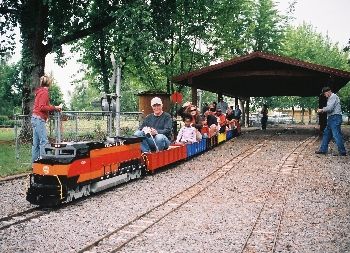 Scale train engineer giving kids a ride