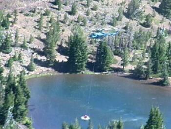 Helicopter gathering water near Black Crater Fire