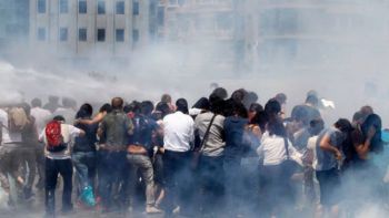 Riot police use tear gas to disperse the crowd during an anti-government protest at Taksim Square in central Istanbul on June 1, 2013.