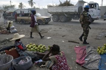 A Sri Lankan UN peacekeeper patrols the Central Market in Port-au-Prince, Haiti, a sensitive area where security measures have been increased.