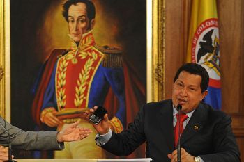 Hugo Chávez Under a Painting of Simón Bolivar