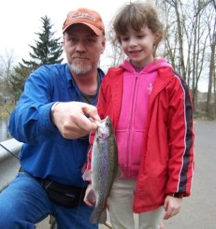 Mitch Webb and Penny Olheiser display a fish from the day's catch