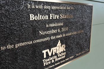 The Brass Dedication Plaque on the Side of the Fire Station